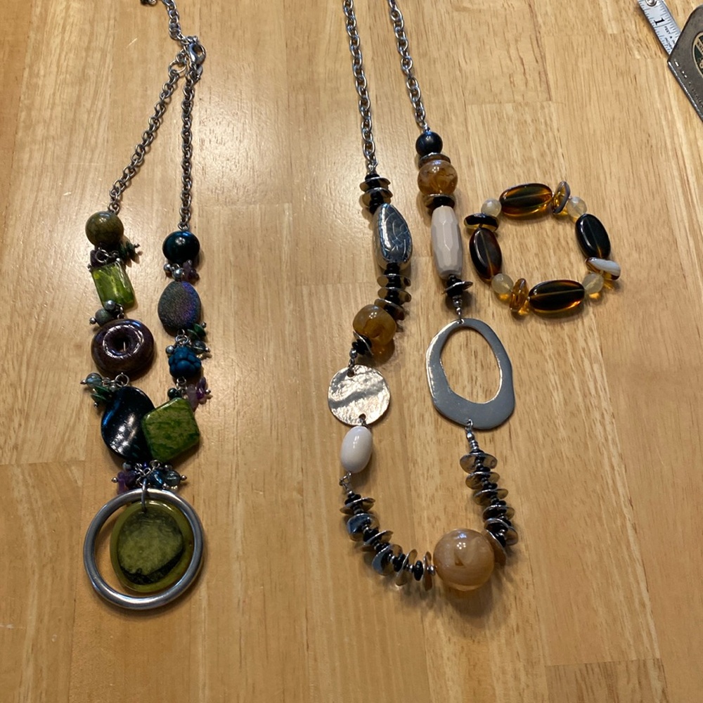 The necklace on the left is 10”. The one on the right is 14”with the bracelet